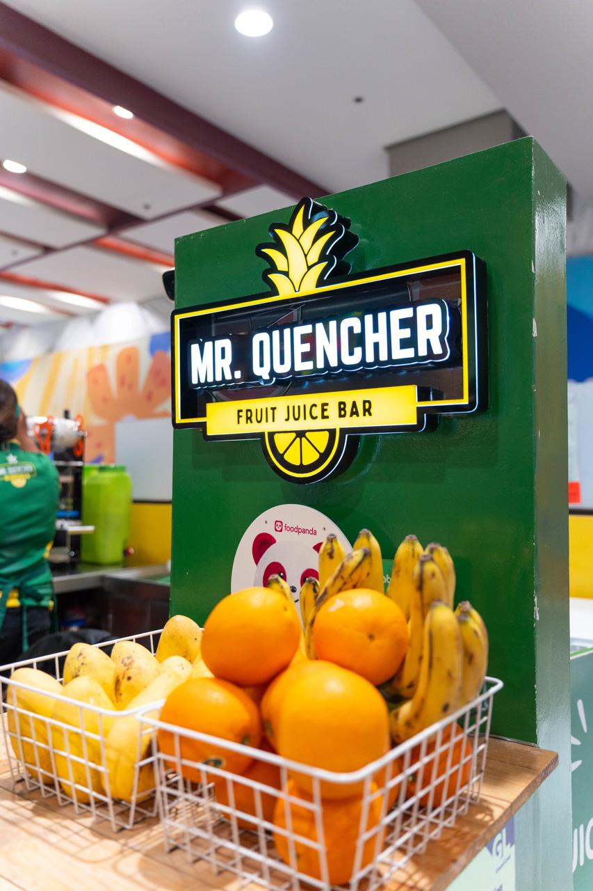 Mr. Quencher signage with fresh fruit